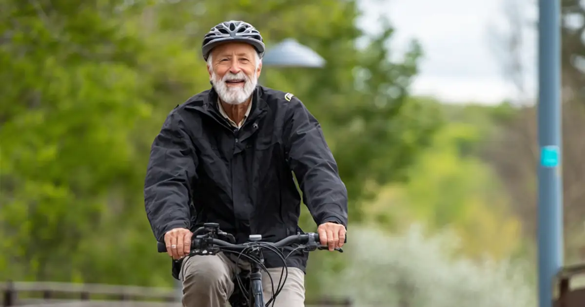 2 Photo of a senior on a bike