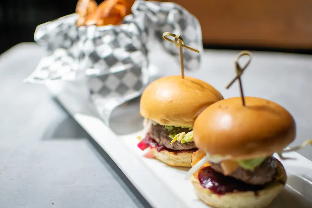 Lamburger sliders Lamburgers with a basket of fries